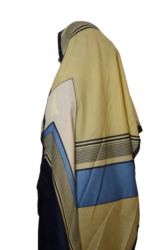 Model wearing a linear panel modal hijab in olive, blue, cream, and navy tones