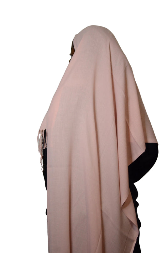 Model wearing the Classic Blush Tassel Hijab with a smooth drape and subtle tassel finish