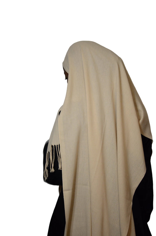 Model wearing the Classic Soft Peach Tassel Hijab with a soft drape and tassel detailing