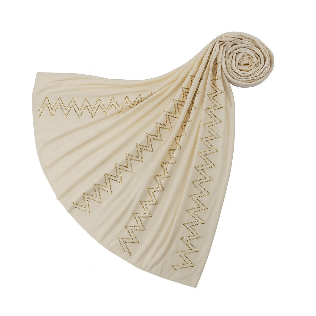 https://www.amodeyah.com/cdn/shop/files/Cream Premium Jersey Hijab with Golden Zigzag Embellishments.jpg