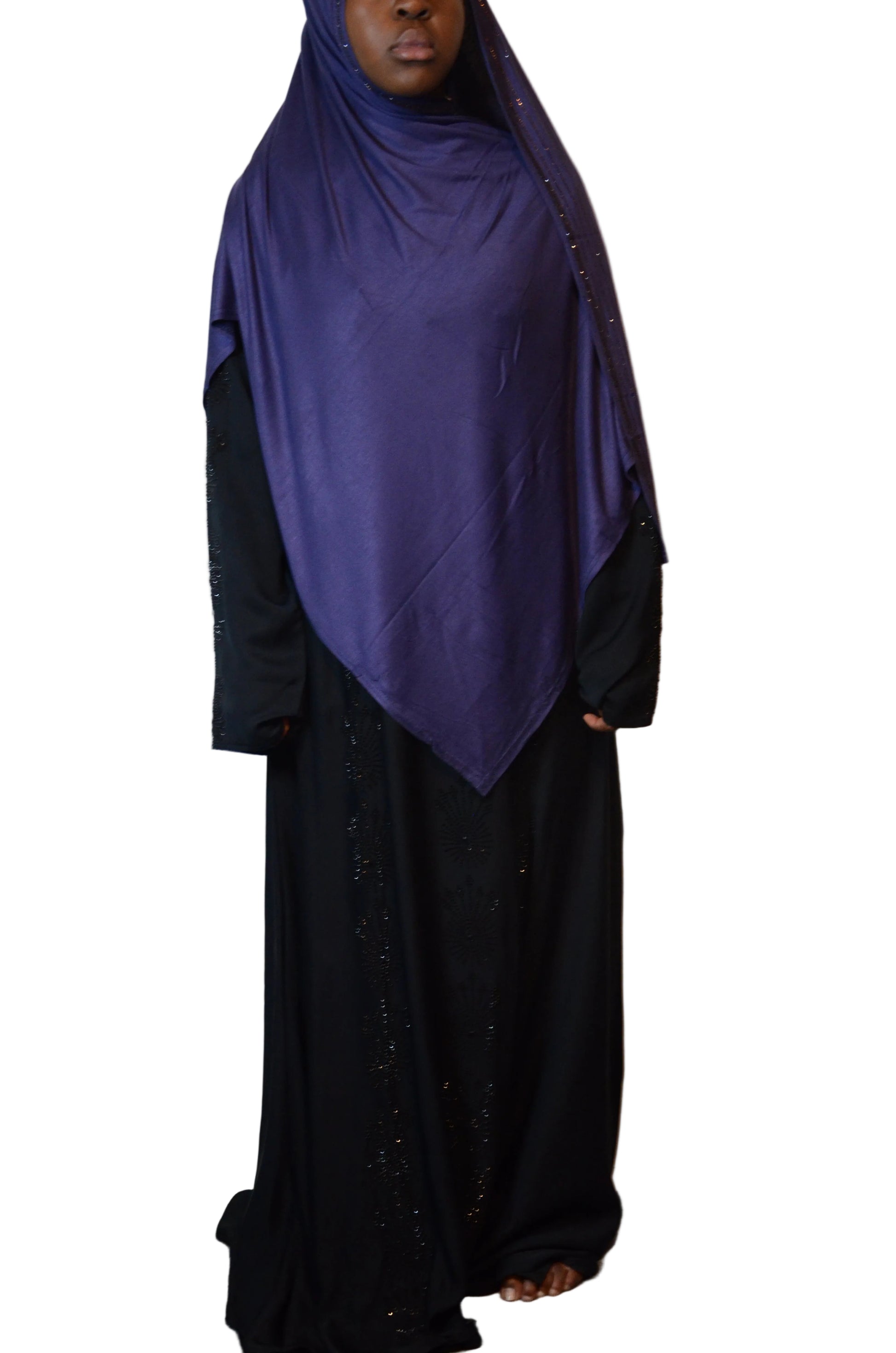 Model wearing a deep navy premium cotton jersey hijab with subtle rhinestone edge, styled with full coverage and elegant drape.