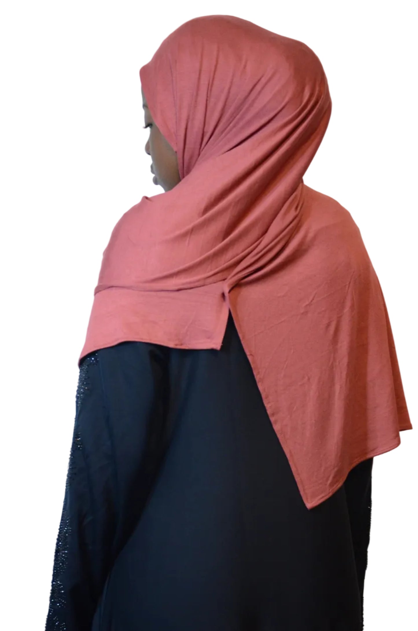 Model wearing a dusty rose plain jersey hijab styled loosely from the back