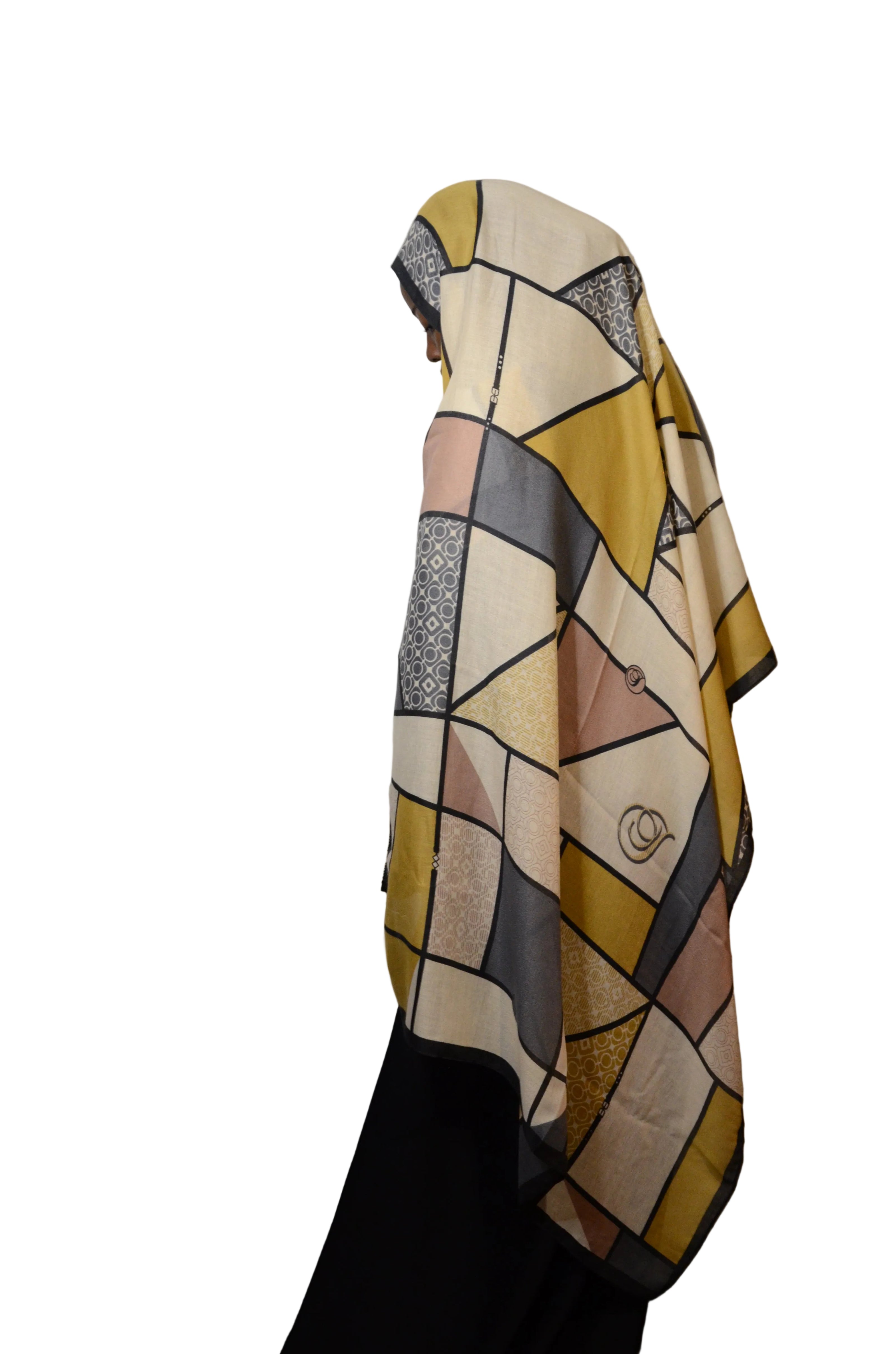 Model wearing the Modern Geometric Modal Hijab in neutral beige, mustard, and grey tones, shown in