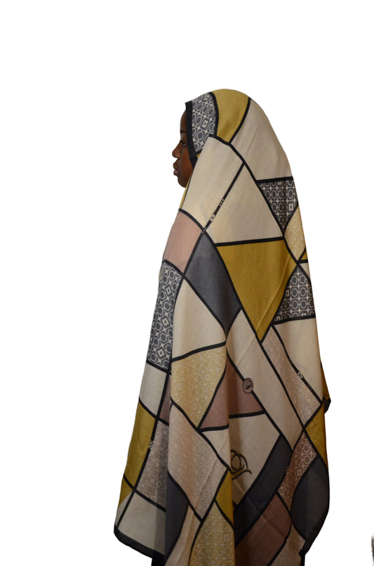 Abstract patterned fabric draped over a surface with a plain background