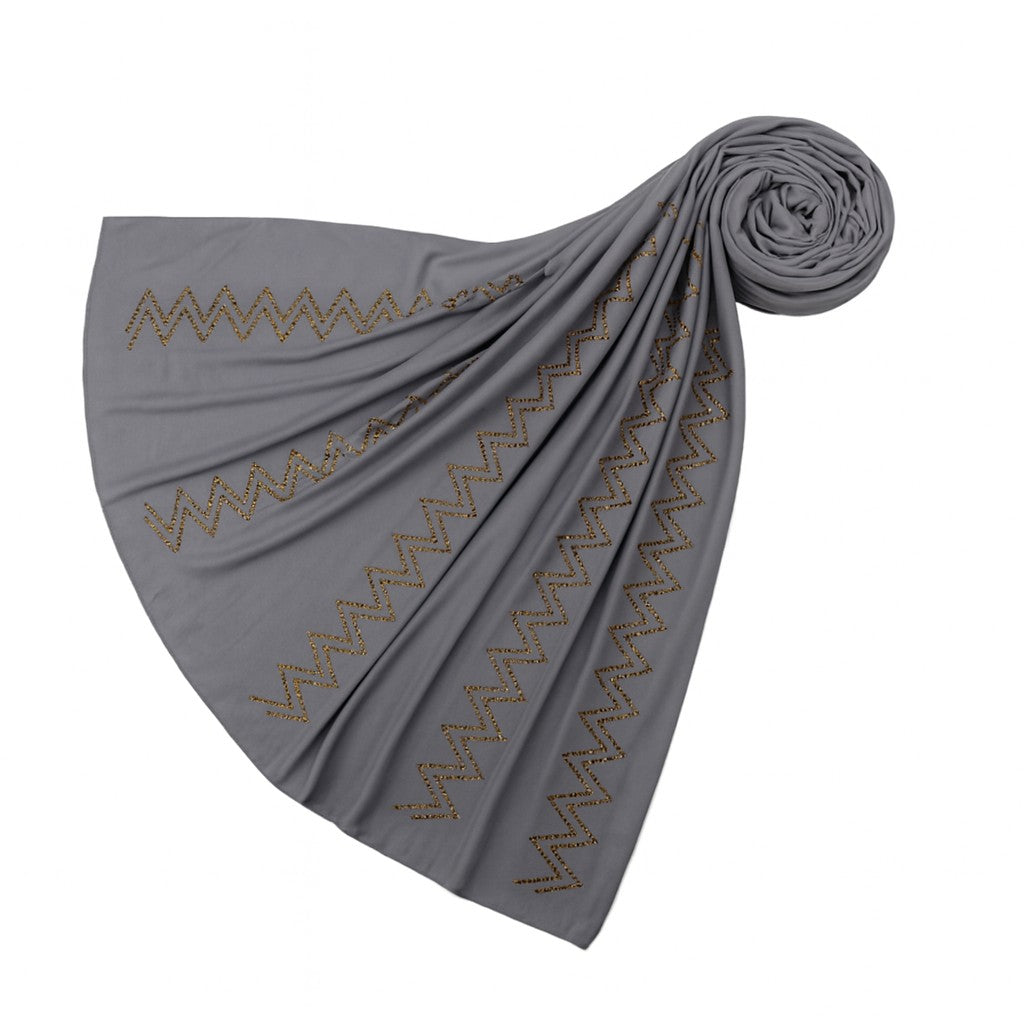 https://www.amodeyah.com/cdn/shop/files/Gray Premium Jersey Hijab with Golden Zigzag Embellishments.jpg