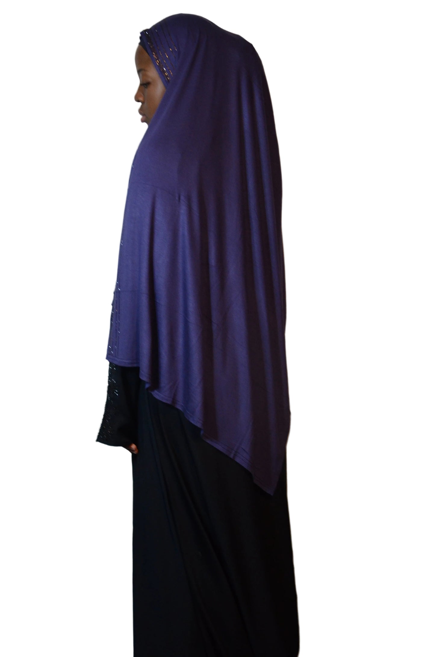 Model wearing a deep navy premium jersey hijab with rhinestone trim, showing smooth drape and full back coverage.