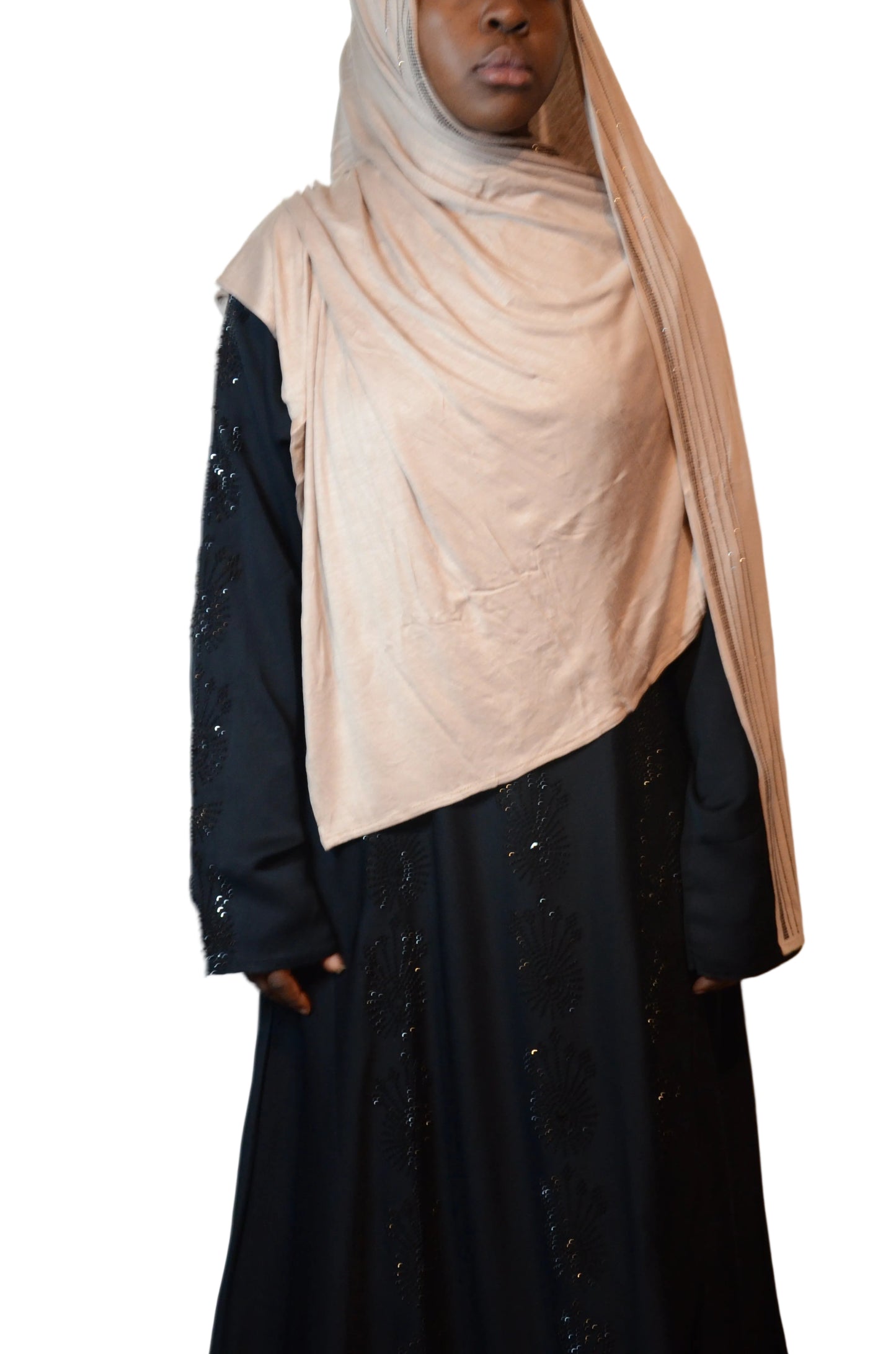 Model wearing a premium jersey hijab with rhinestone trim, styled with a black abaya, front view.