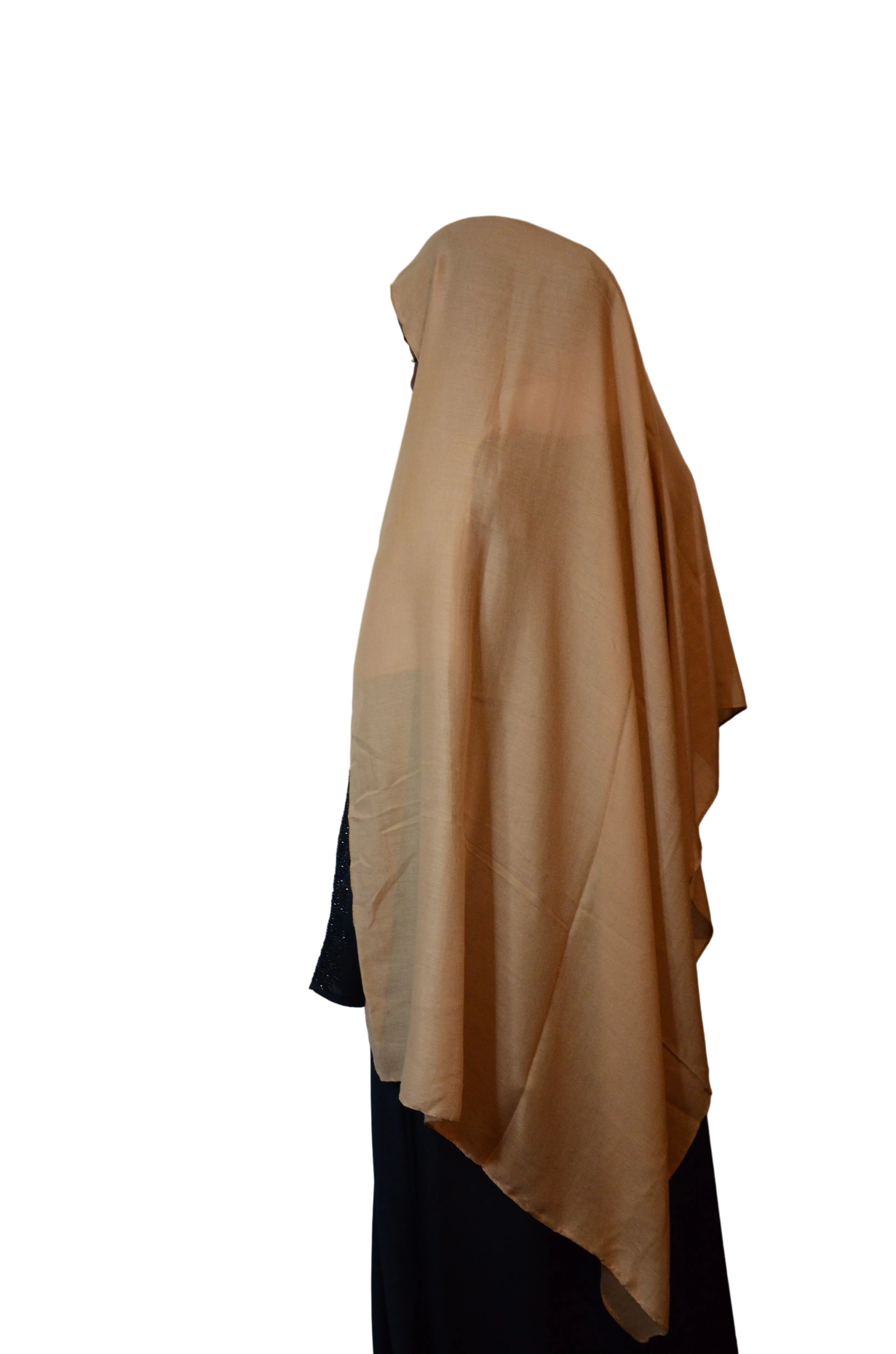 Model wearing a sand beige hijab from the side, highlighting the smooth fabric flow and full back coverage.