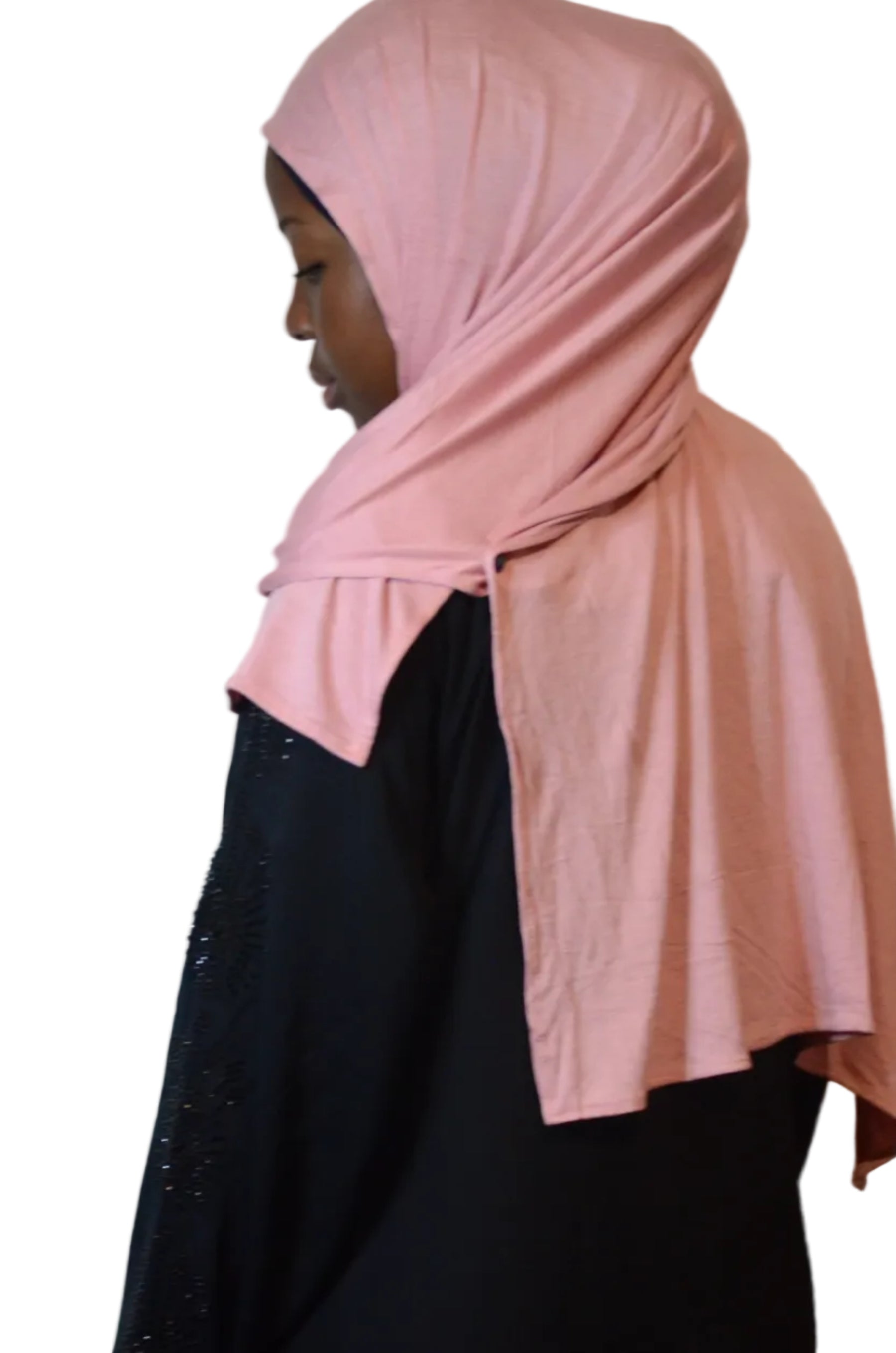 Model wearing soft rose pink plain jersey hijab styled with full front coverage