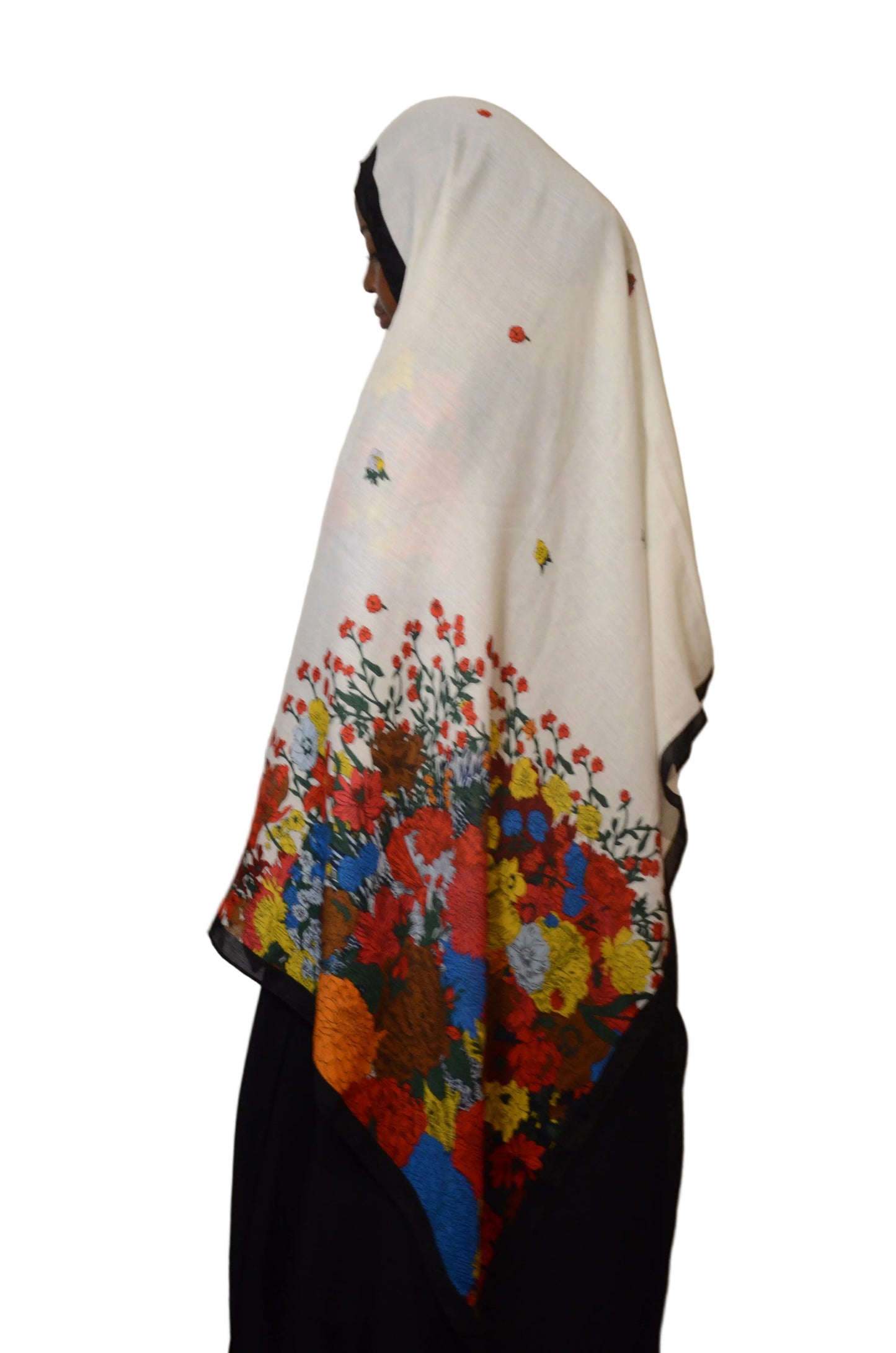 Model wearing a white cotton voile linen hijab featuring vibrant multicolour floral prints and a soft breathable drape.